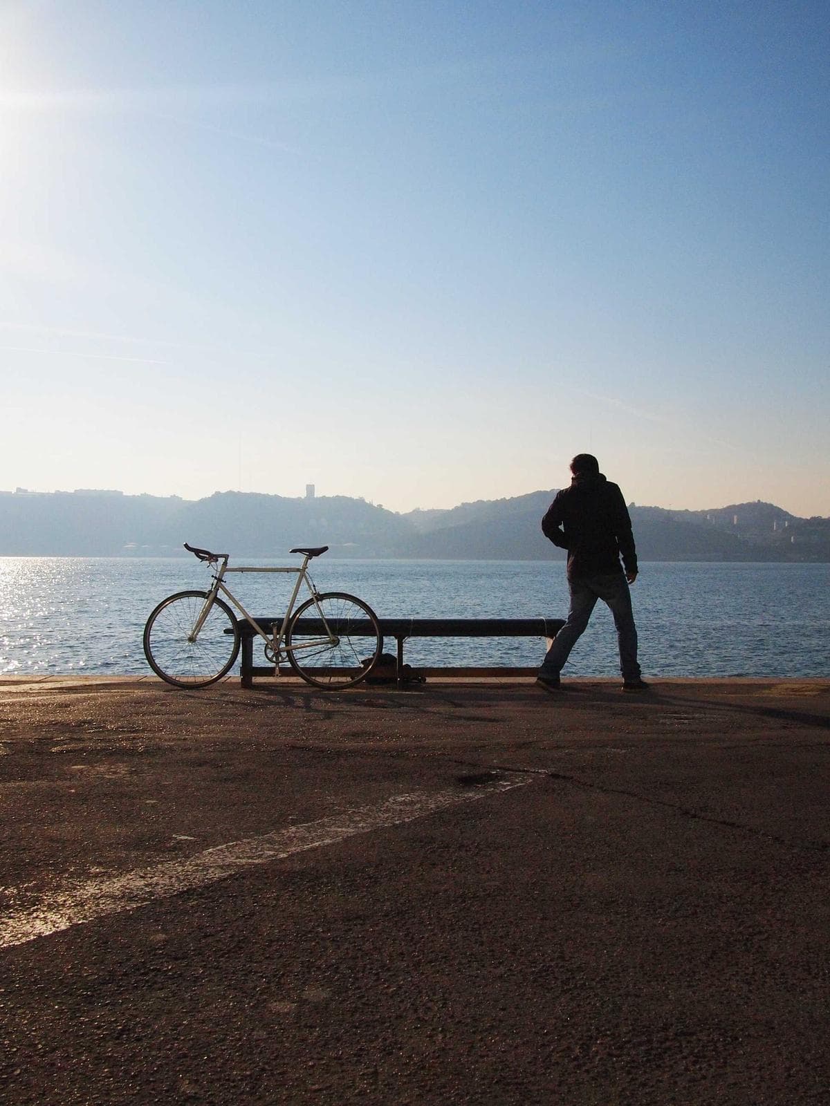 Backlit silhouette on a waterfront